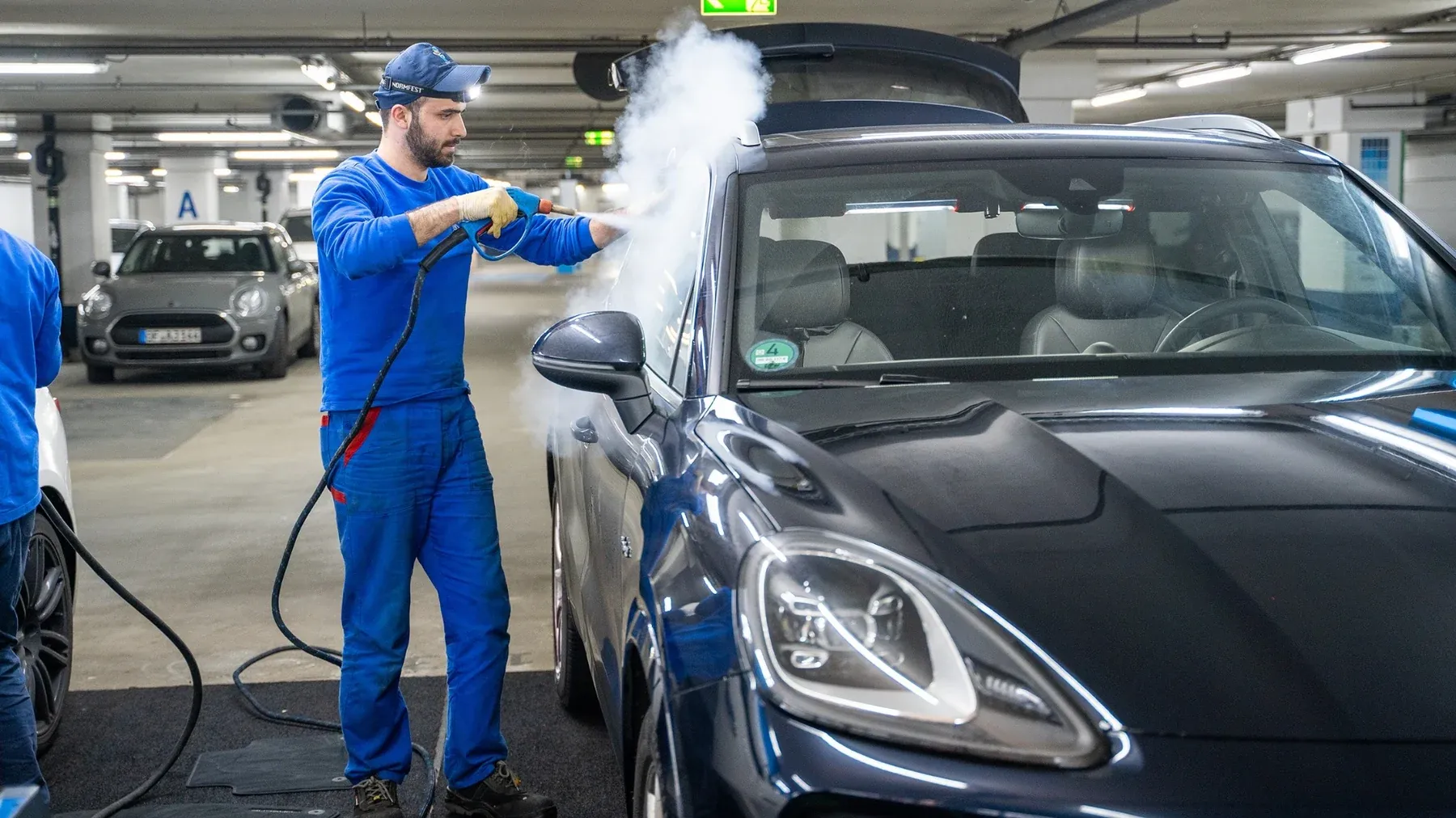 Parknwash technician carrying out professional vehicle cleaning
